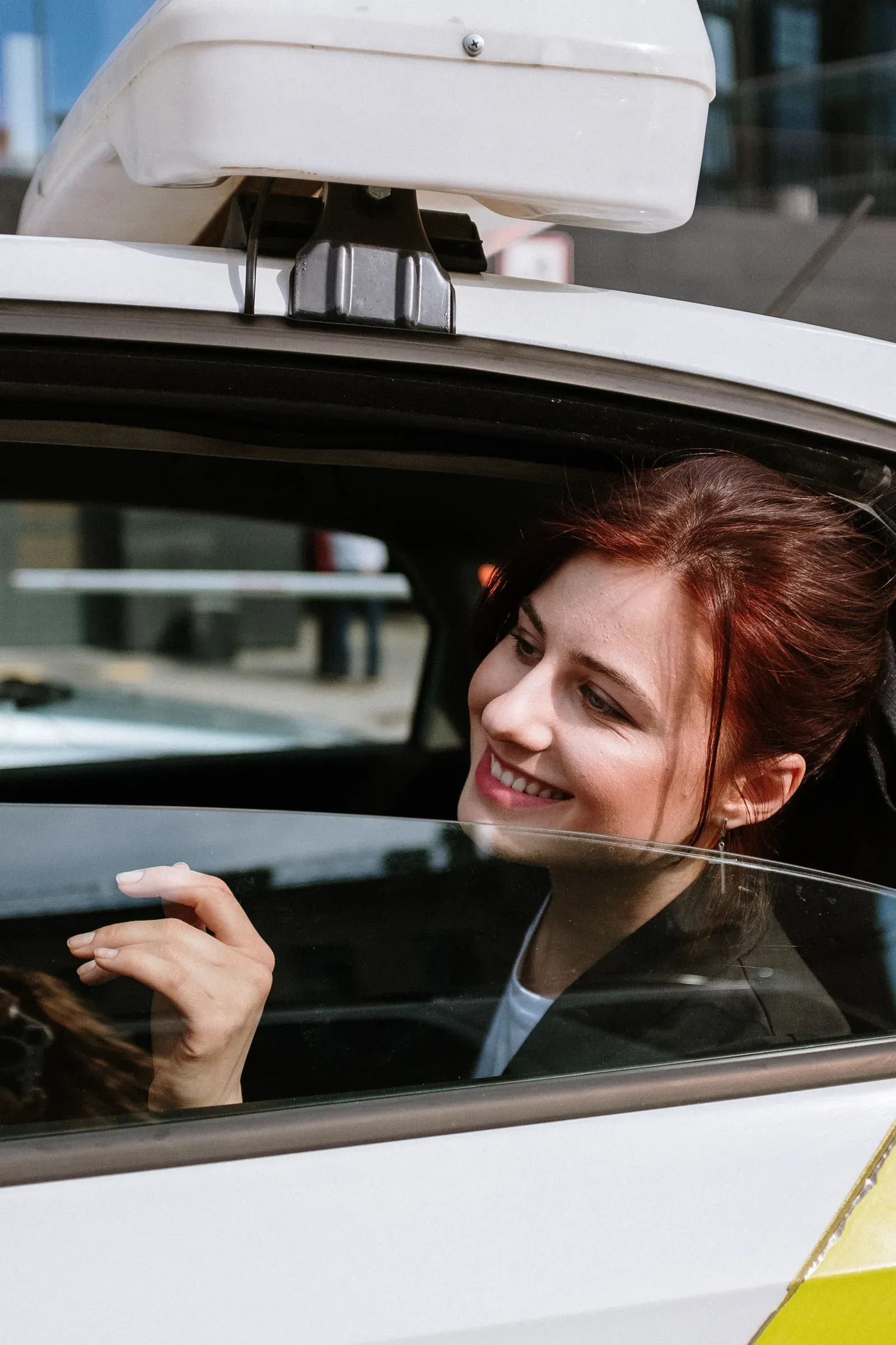 Passenger entering a rideshare vehicle in the city